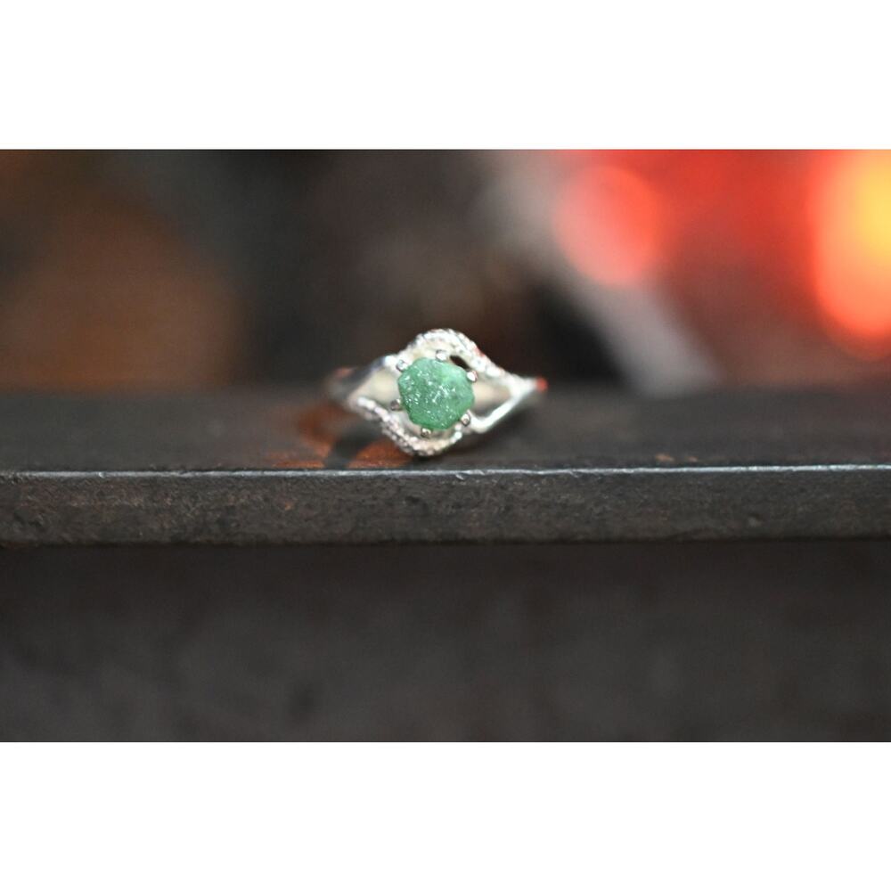 Raw emerald engagement ring